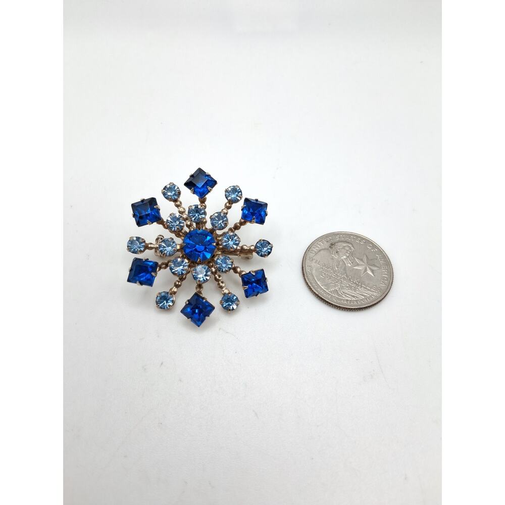42.  Vintage prong set brooch in shades of blue